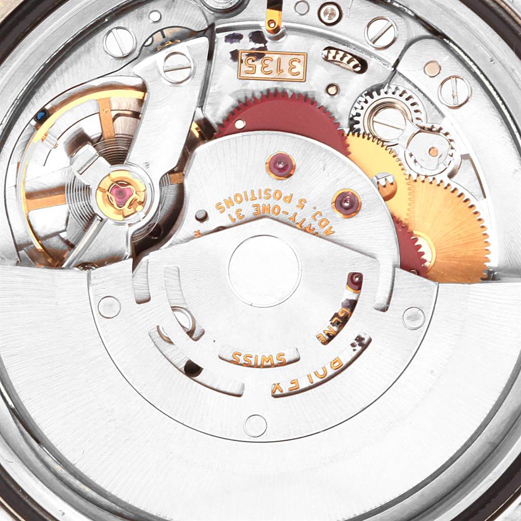 The image shows the internal mechanism and movement parts of a Rolex Submariner 16613 Men's Steel and Gold (two tone) Grey Dial 16613 Men's Steel and Gold (two tone) Grey Dial watch from a close-up angle.