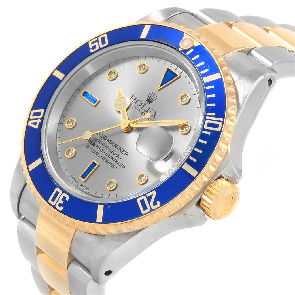 The Rolex Submariner 16613 Men's Steel and Gold (two tone) Grey Dial 16613 Men's Steel and Gold (two tone) Grey Dial watch is shown at a slight angle highlighting its dial, bezel, crown, and part of the bracelet.