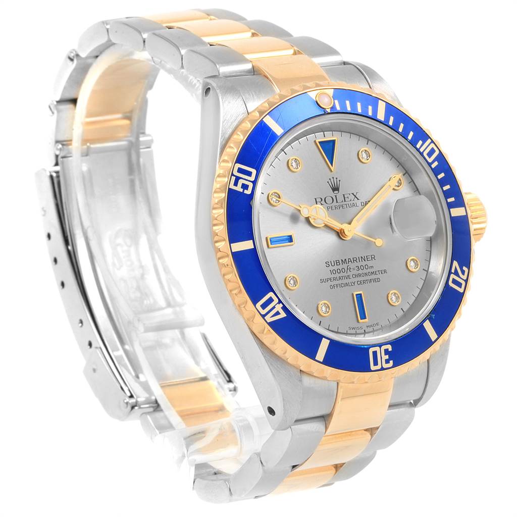 This image shows a side and front angle of the Rolex Submariner 16613 Men's Steel and Gold (two tone) Grey Dial 16613 Men's Steel and Gold (two tone) Grey Dial watch, highlighting its bezel, dial, crown, and two-tone bracelet.