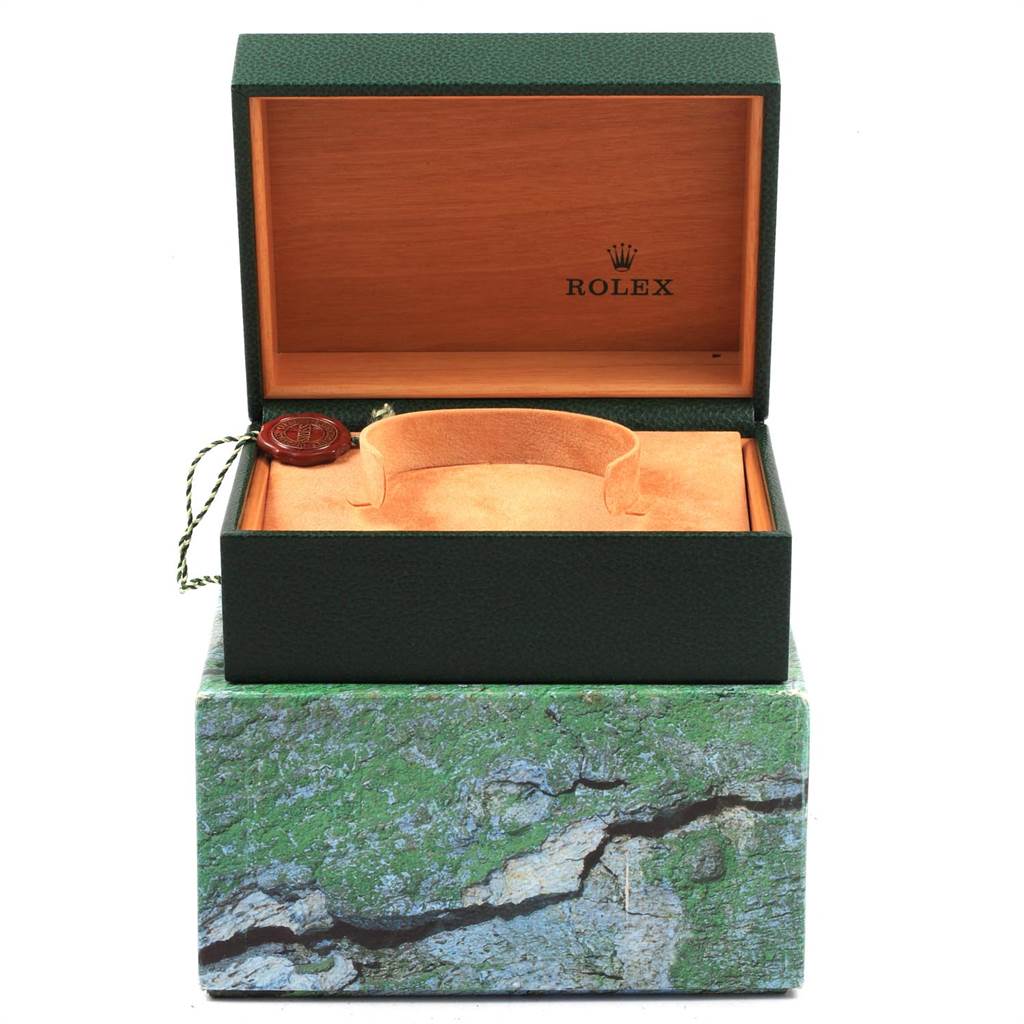 This image shows the open box of a Rolex Submariner 16613 Men's Steel and Gold (two tone) Grey Dial 16613 Men's Steel and Gold (two tone) Grey Dial model, including the watch cushion and hangtag.