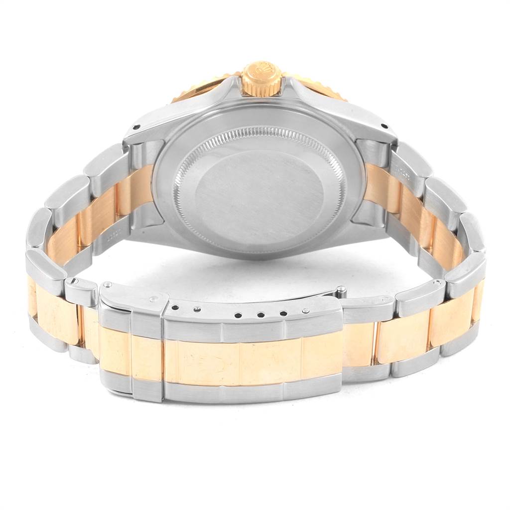 The image shows the back view of the Rolex Submariner 16613 Men's Steel and Gold (two tone) Grey Dial 16613 Men's Steel and Gold (two tone) Grey Dial watch, highlighting its two-tone bracelet and case back.
