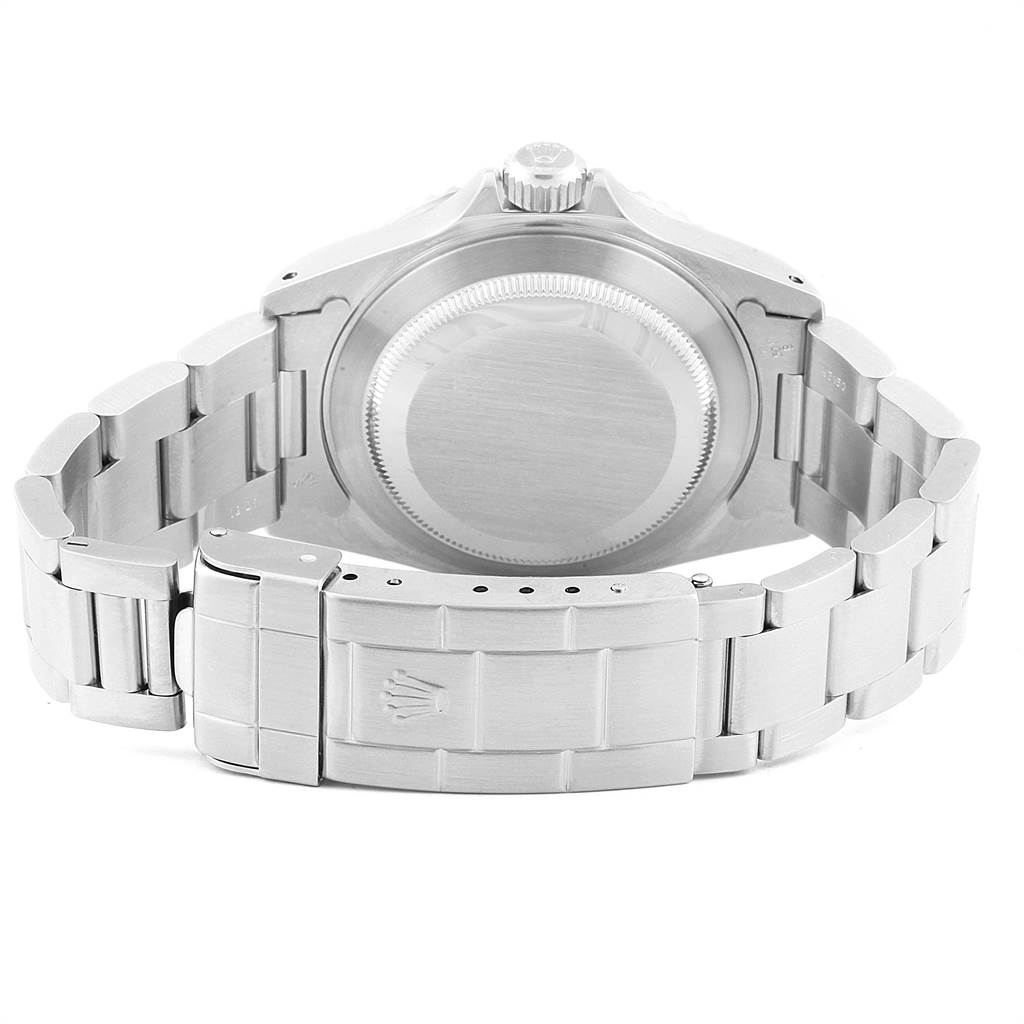 The image shows the back view of a Rolex Submariner 14060 Men's Stainless Steel Black Dial 14060 Men's Stainless Steel Black Dial watch, including the case back, bracelet, and clasp.