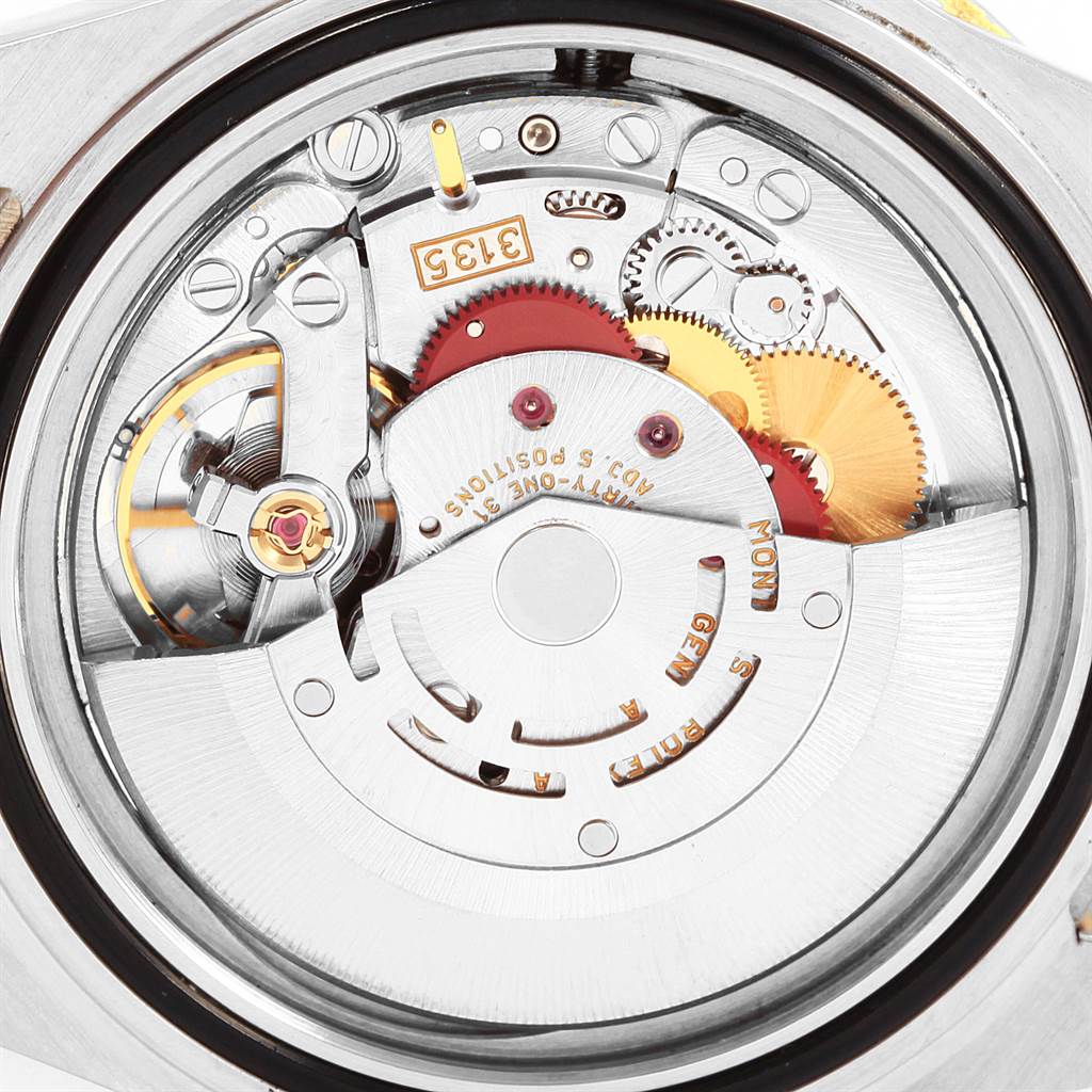 This image shows the inner mechanical movement of a Rolex Submariner 16613 Men's Steel and Gold (two tone) Blue Dial 16613 Men's Steel and Gold (two tone) Blue Dial watch from a rear view angle.