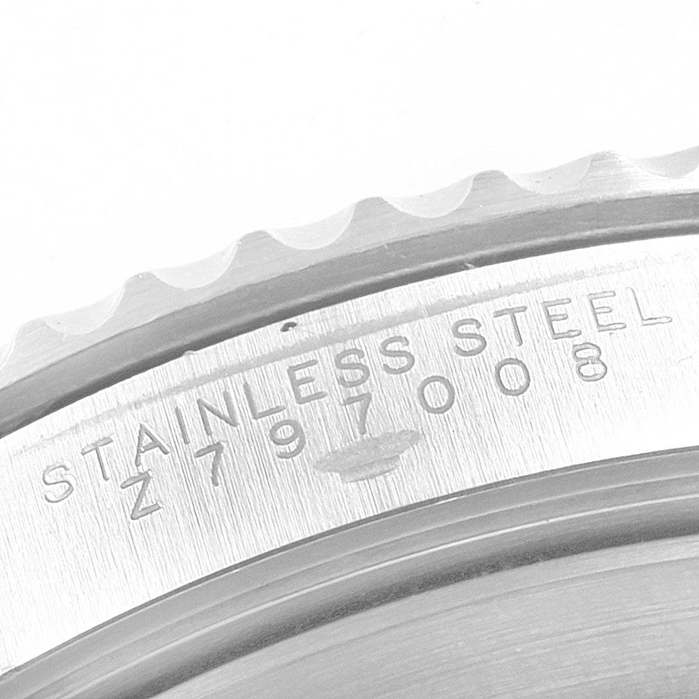 This image shows a close-up of the stainless steel caseback of a Rolex Submariner 14060 Men's Stainless Steel Black Dial 14060 Men's Stainless Steel Black Dial watch.