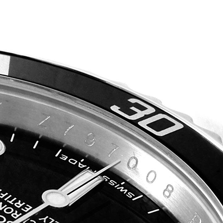 The image shows a close-up of the bezel and partial dial of a Rolex Submariner 14060 Men's Stainless Steel Black Dial 14060 Men's Stainless Steel Black Dial, capturing the 30-minute marker.
