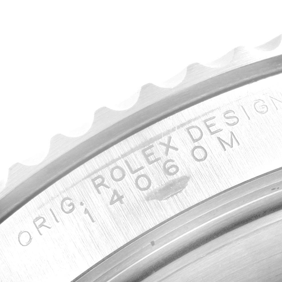 This close-up image shows the engraved bezel and case of the Rolex Submariner 14060 Men's Stainless Steel Black Dial 14060 Men's Stainless Steel Black Dial watch.