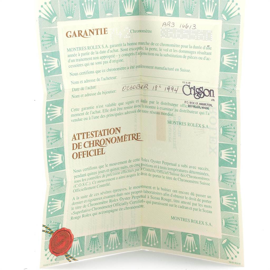 The image shows a warranty certificate for a Rolex Submariner 16613 Men's Steel and Gold (two tone) Blue Dial 16613 Men's Steel and Gold (two tone) Blue Dial watch, featuring handwritten details and official stamps.