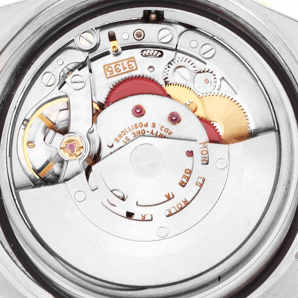 The image shows the internal movement and mechanism of a Rolex Submariner 16613 Men's Steel and Gold (two tone) Blue Dial 16613 Men's Steel and Gold (two tone) Blue Dial watch, viewed from the back.