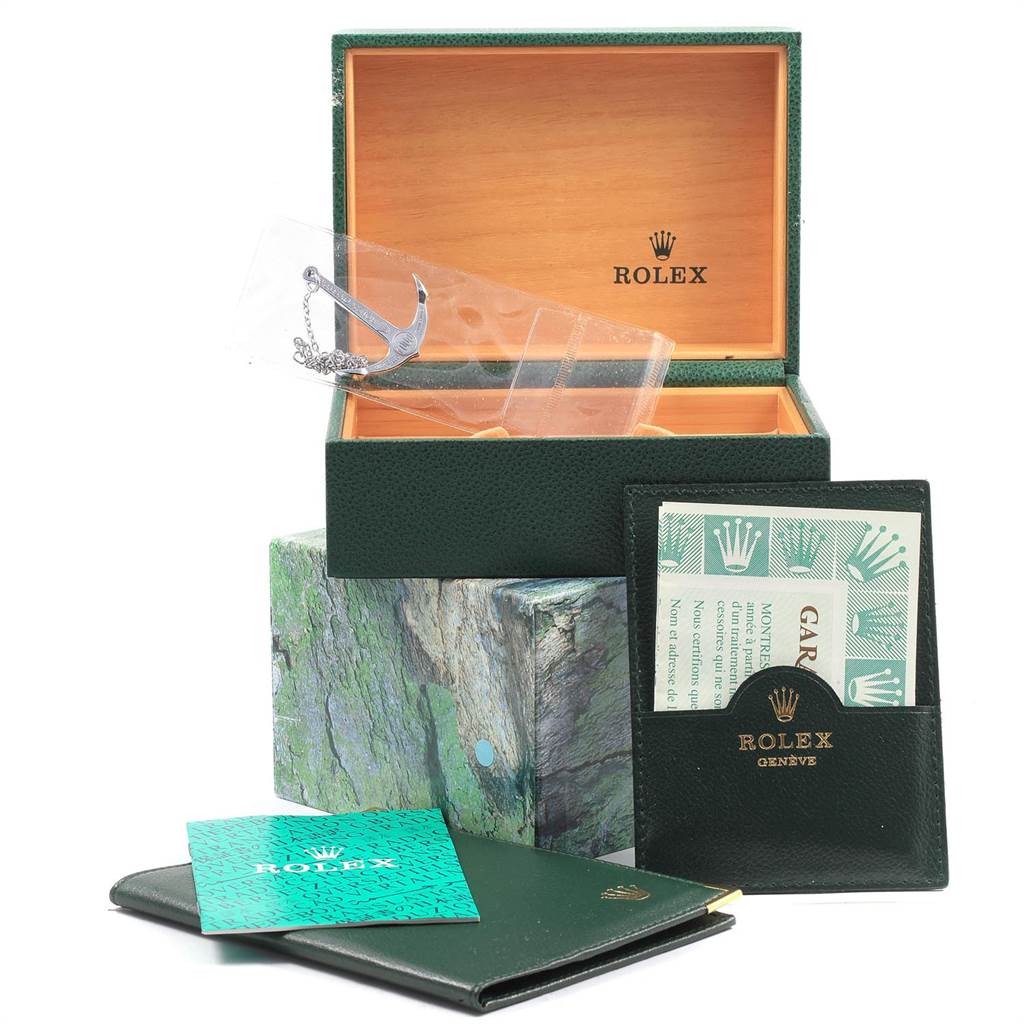 The image shows a Rolex Submariner 16613 Men's Steel and Gold (two tone) Blue Dial 16613 Men's Steel and Gold (two tone) Blue Dial watch box, guarantee card holder, manual, and an anchor pendant.