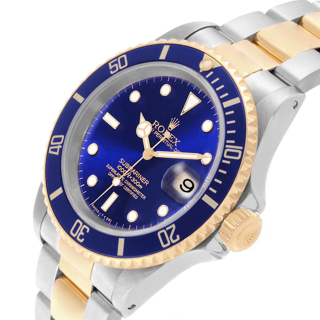 The image shows an angled view of a Rolex Submariner 16613 Men's Steel and Gold (two tone) Blue Dial 16613 Men's Steel and Gold (two tone) Blue Dial watch, highlighting the bezel, dial, crown, and part of the bracelet.