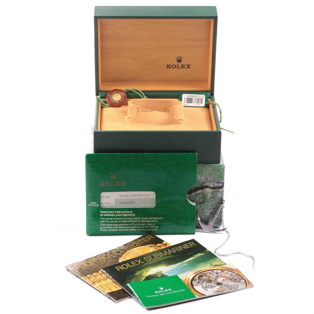 The image displays Rolex Submariner 16613 Men's Steel and Gold (two tone) Blue Dial 16613 Men's Steel and Gold (two tone) Blue Dial watch accessories, including the box, warranty card, and booklets, from a front angle.