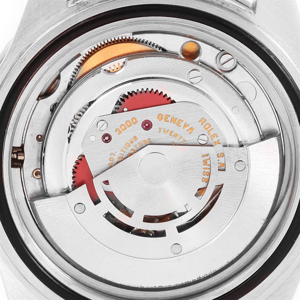 The image shows a close-up view of the movement mechanism of a Rolex Submariner 14060 Men's Stainless Steel Black Dial 14060 Men's Stainless Steel Black Dial watch.