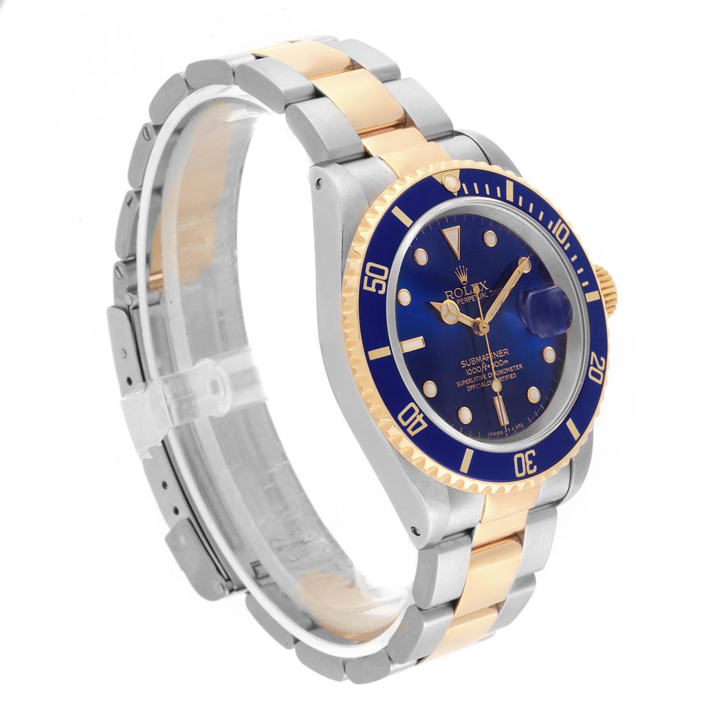 This image shows a side and front angle of a Rolex Submariner 16613 Men's Steel and Gold (two tone) Blue Dial 16613 Men's Steel and Gold (two tone) Blue Dial watch, highlighting its blue dial, gold and silver bracelet, and bezel.
