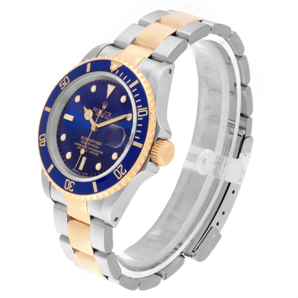 The image shows a Rolex Submariner 16613 Men's Steel and Gold (two tone) Blue Dial 16613 Men's Steel and Gold (two tone) Blue Dial watch at an angle displaying the face, crown, and part of the bracelet.