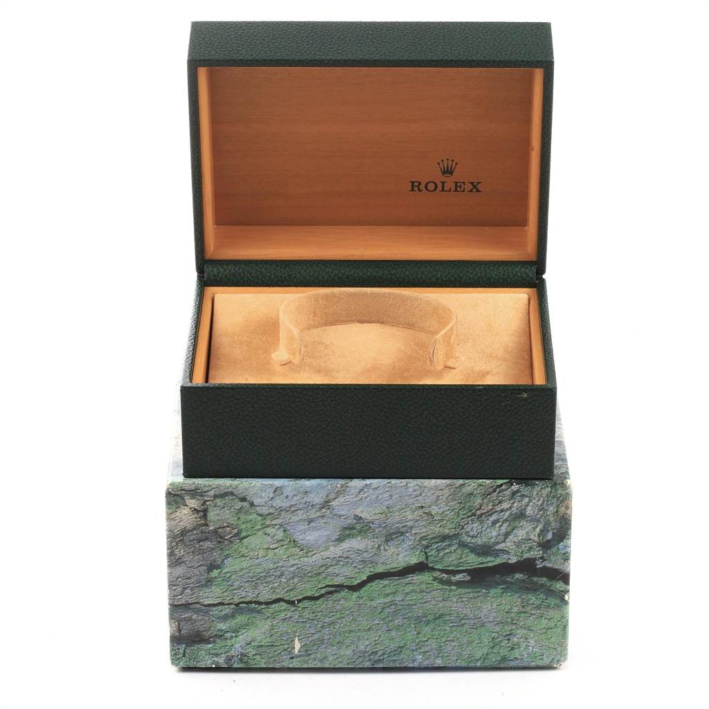 The image shows an open Rolex watch box with an empty cushion, typically used for holding a Rolex Submariner 16613 Men's Steel and Gold (two tone) Blue Dial 16613 Men's Steel and Gold (two tone) Blue Dial model.