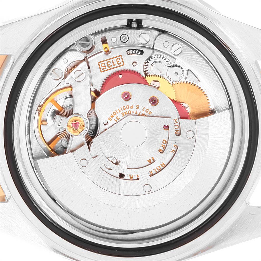 The image shows the inner mechanism and movement of a Rolex Submariner 16613 Men's Steel and Gold (two tone) Blue Dial 16613 Men's Steel and Gold (two tone) Blue Dial watch viewed from the back.