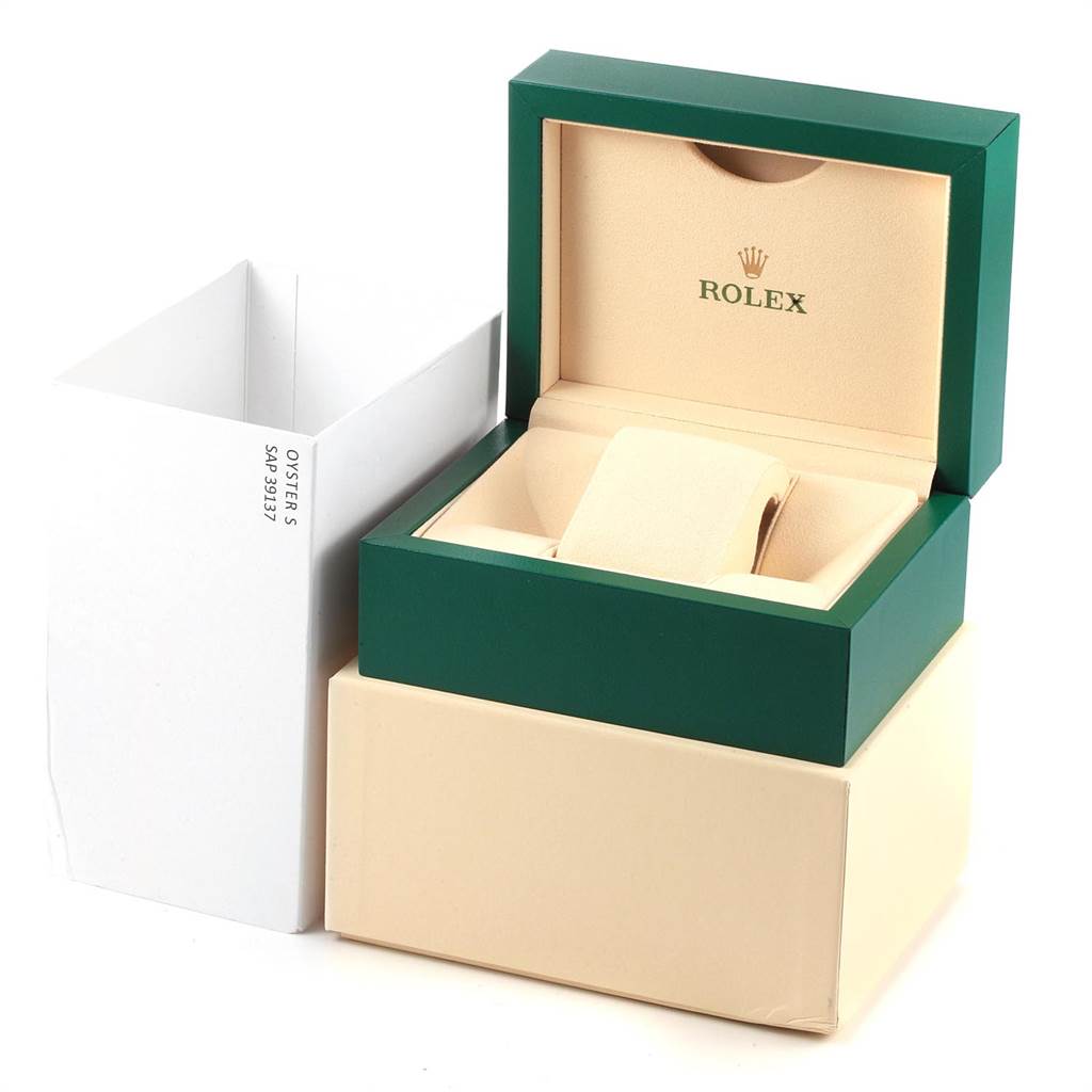 The image shows the packaging box for a Rolex Submariner 114060 Men
s Stainless Steel Black Dial 114060 Men
s Stainless Steel Black Dial watch, featuring an open green and beige watch box with a beige cushion.