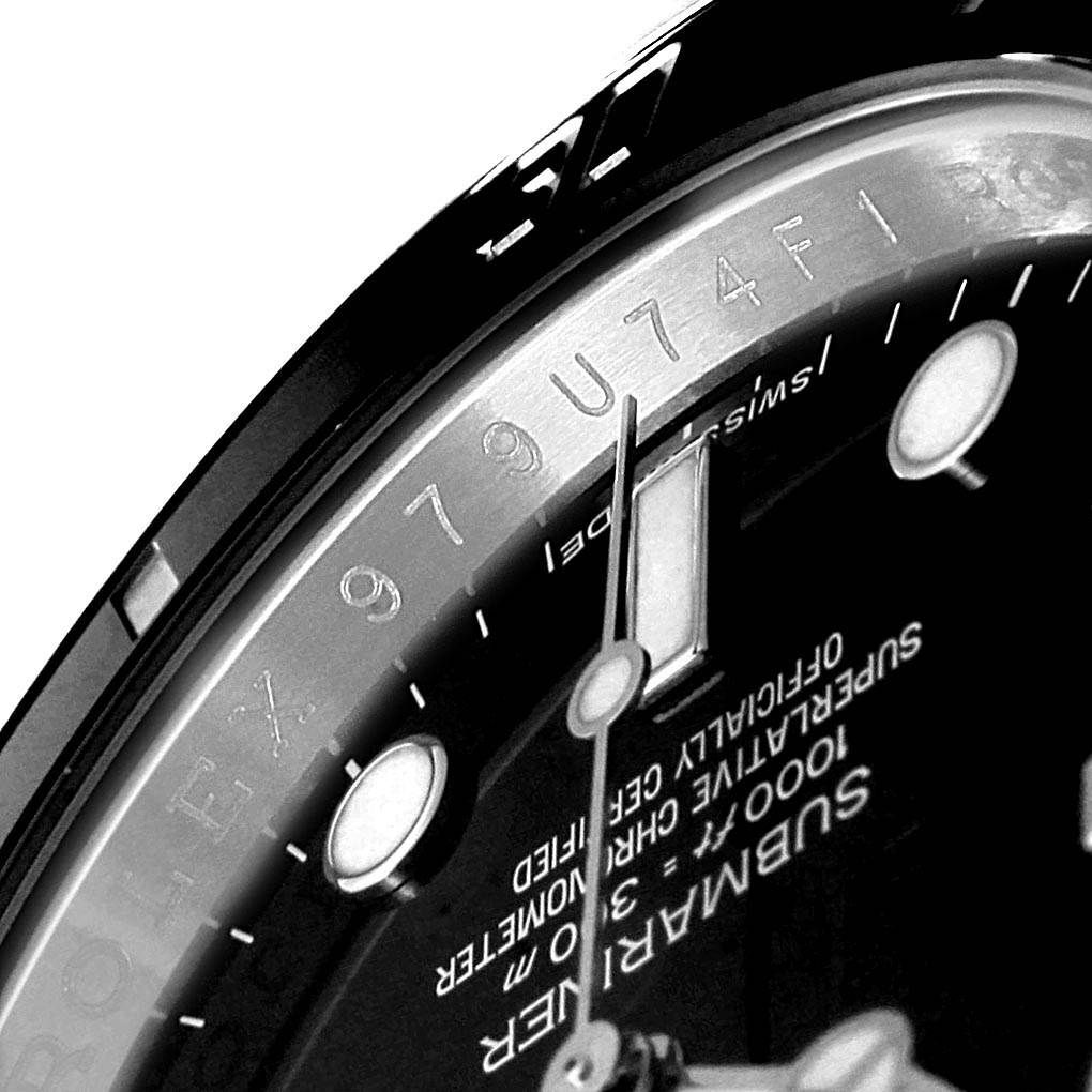 This close-up image shows the dial and serialized rehaut of a Rolex Submariner 114060 Men
s Stainless Steel Black Dial 114060 Men
s Stainless Steel Black Dial watch.