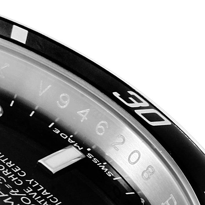 This image shows a close-up of the bezel and part of the dial of a Rolex Submariner 16610 Men's Stainless Steel Black Dial 16610 Men's Stainless Steel Black Dial watch.