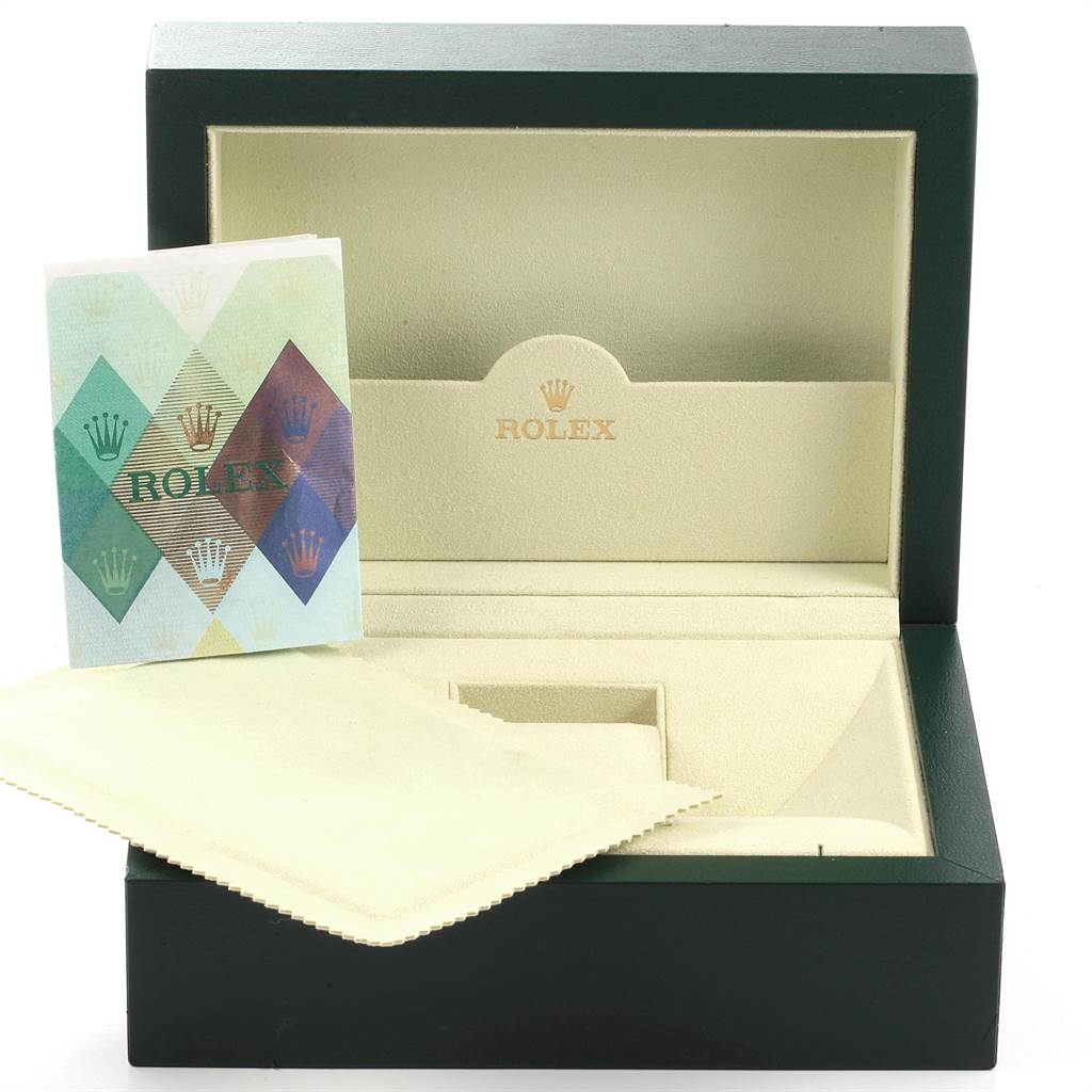 The image shows the open box, cloth, and manual for the Rolex Submariner 16613 Men's Steel and Gold (two tone) Blue Dial 16613 Men's Steel and Gold (two tone) Blue Dial watch.