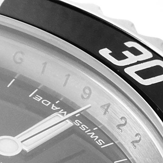 This close-up image of the Rolex Submariner 14060 Men's Stainless Steel Black Dial 14060 Men's Stainless Steel Black Dial shows part of the dial, bezel, numbers, and minute hand.