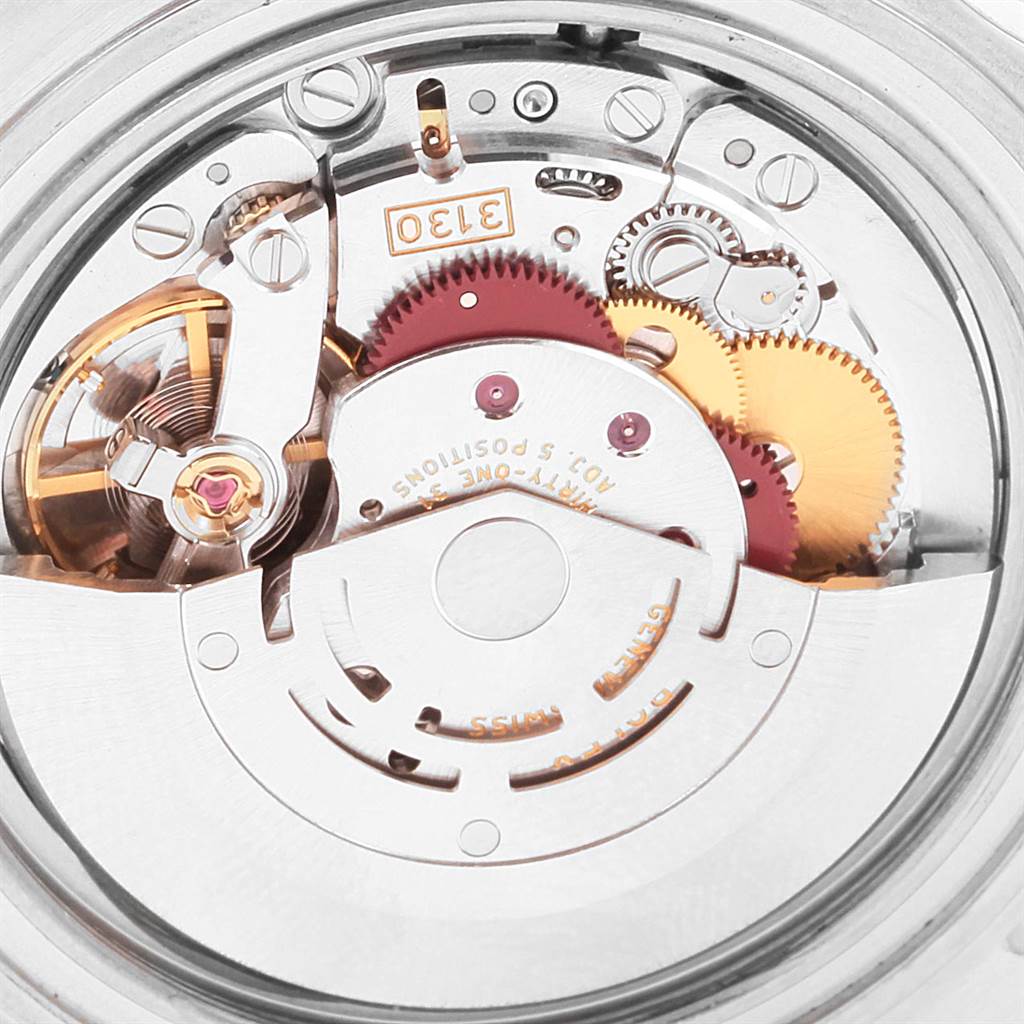 This image shows a close-up view of the movement mechanism inside a Rolex Submariner 14060 Men's Stainless Steel Black Dial 14060 Men's Stainless Steel Black Dial watch.