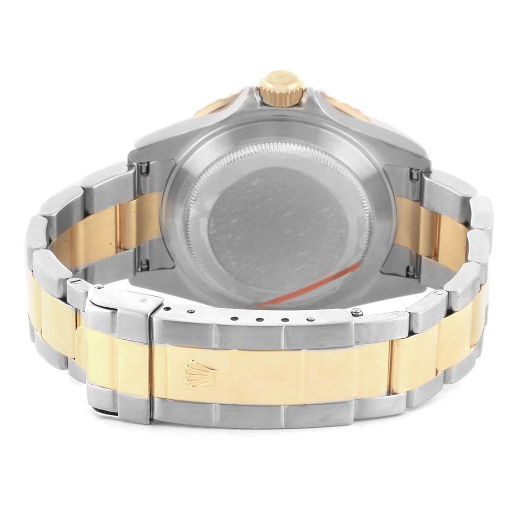 The image shows the back and bracelet of a Rolex Submariner 16613 Men's Steel and Gold (two tone) Grey Dial 16613 Men's Steel and Gold (two tone) Grey Dial watch, highlighting the two-tone clasp and crown.