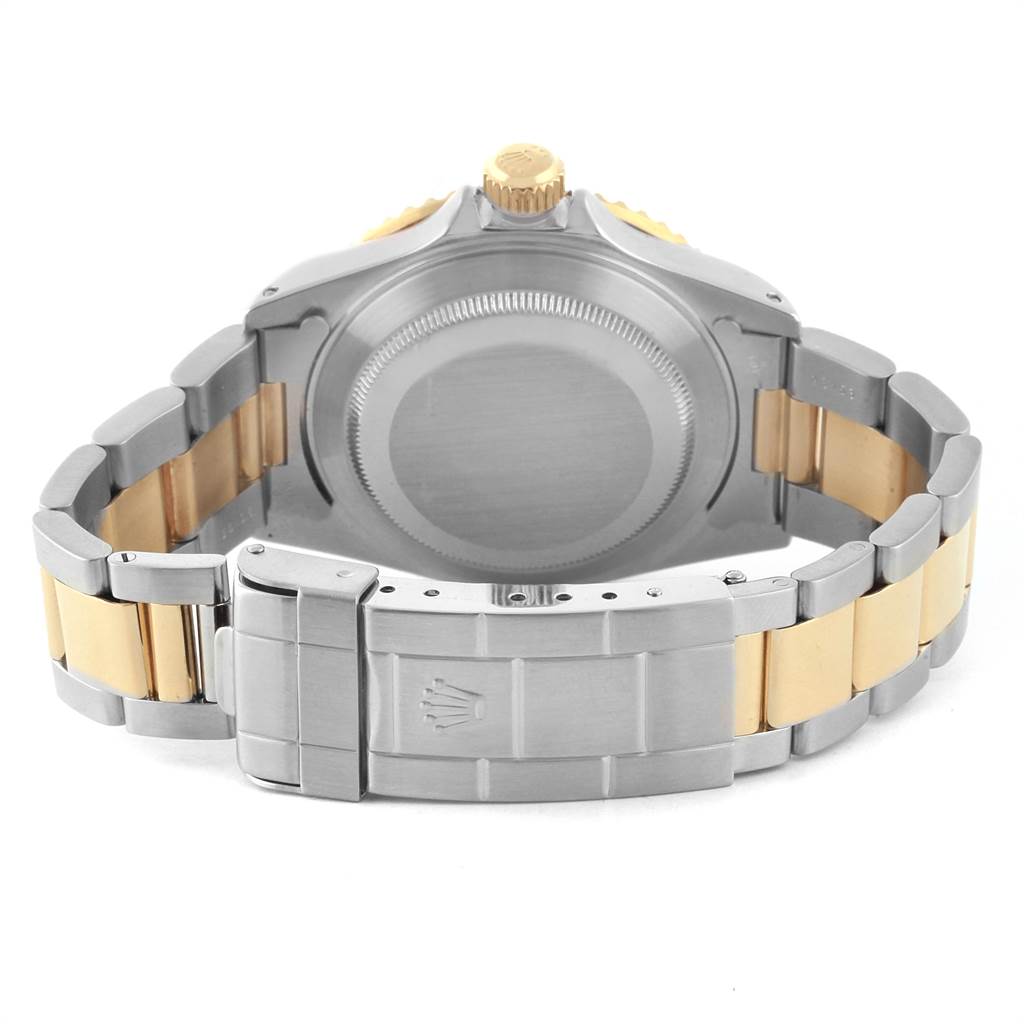 This image shows the back case and clasp of a Rolex Submariner 16613 Men's Steel and Gold (two tone) Blue Dial 16613 Men's Steel and Gold (two tone) Blue Dial watch, highlighting its two-tone metal bracelet.