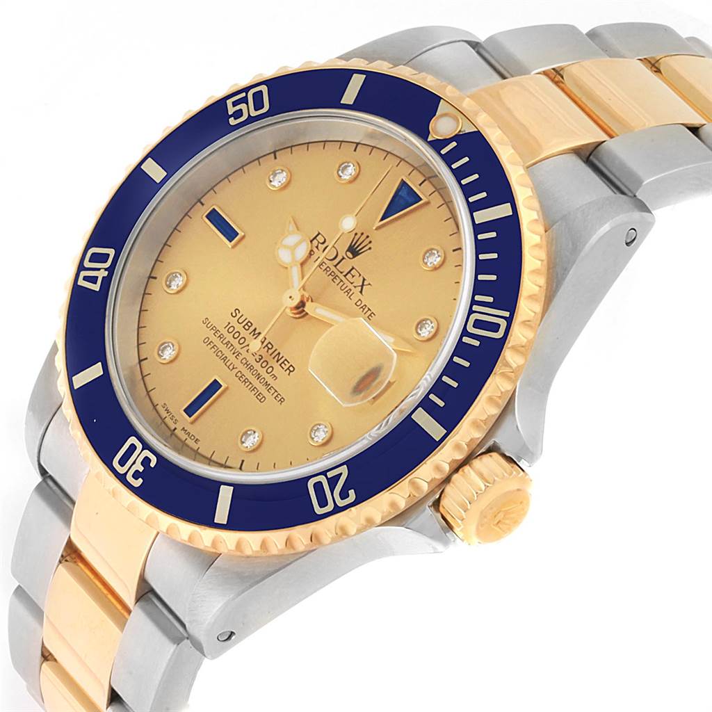 The image shows an angled close-up of a Rolex Submariner 16613 Men
s Steel and Gold (two tone) Champagne Dial 16613 Men
s Steel and Gold (two tone) Champagne Dial watch, highlighting its bezel, dial, crown, and bracelet.