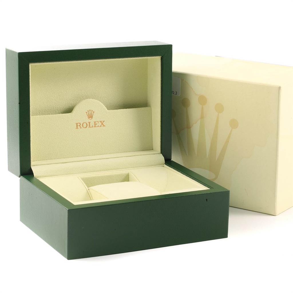 The image shows an open green and beige Rolex box with inner compartments, designed for the Submariner model.