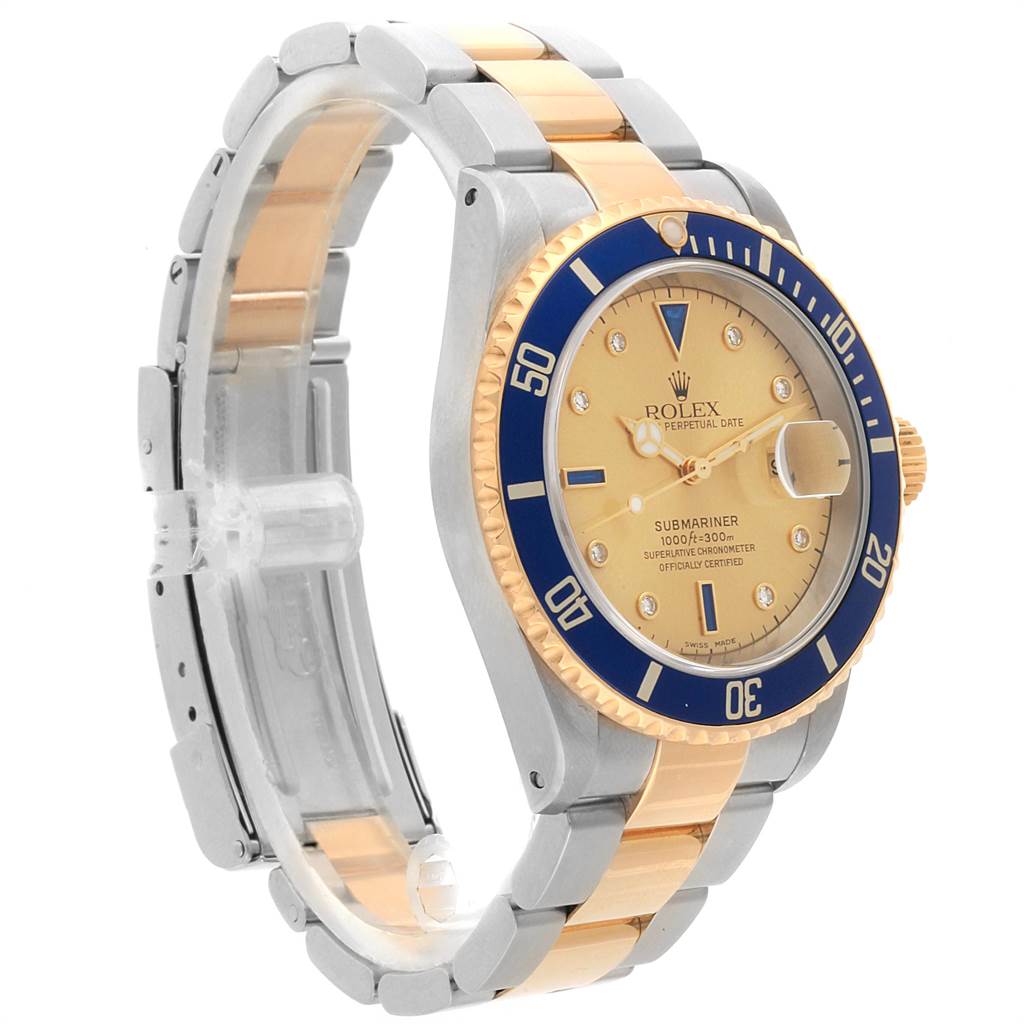 The Rolex Submariner 16613 Men
s Steel and Gold (two tone) Champagne Dial 16613 Men
s Steel and Gold (two tone) Champagne Dial watch is shown at an angle, featuring its gold and blue bezel, gold dial, and two-tone bracelet.