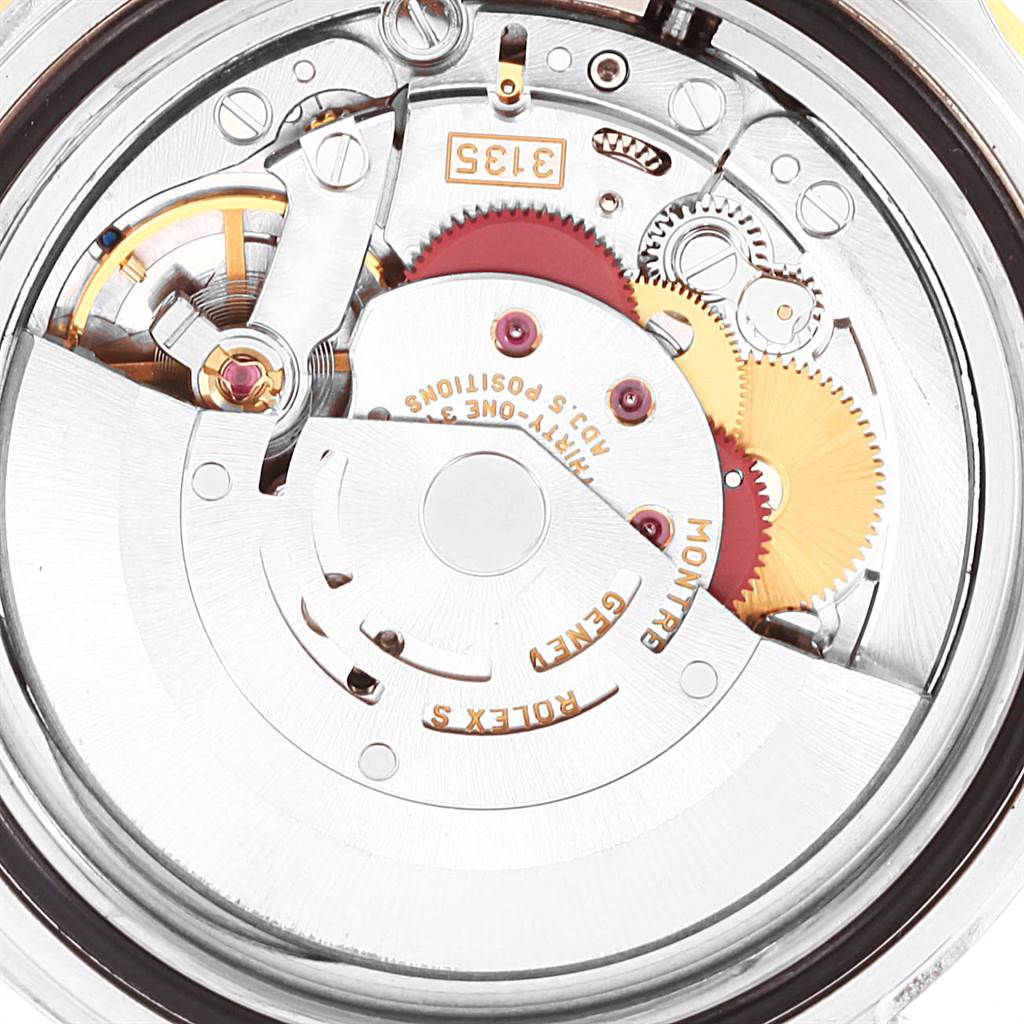 This image shows a close-up view of the internal mechanism of a Rolex Submariner 16613 Men
s Steel and Gold (two tone) Champagne Dial 16613 Men
s Steel and Gold (two tone) Champagne Dial watch, highlighting its movement components.