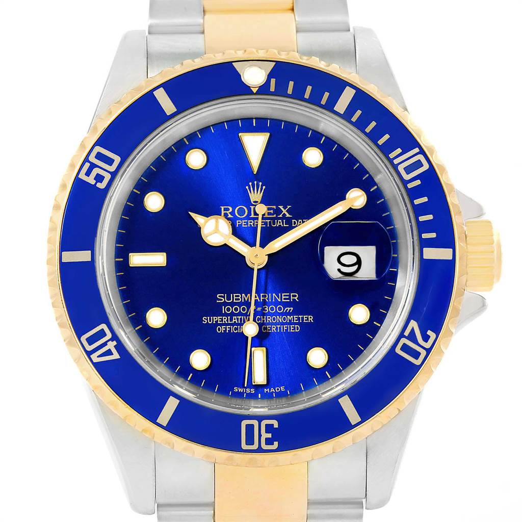 The image shows a front view of a Rolex Submariner 16613 Men's Steel and Gold (two tone) Blue Dial 16613 Men's Steel and Gold (two tone) Blue Dial watch with a blue dial and bezel, gold accents, and a date window.