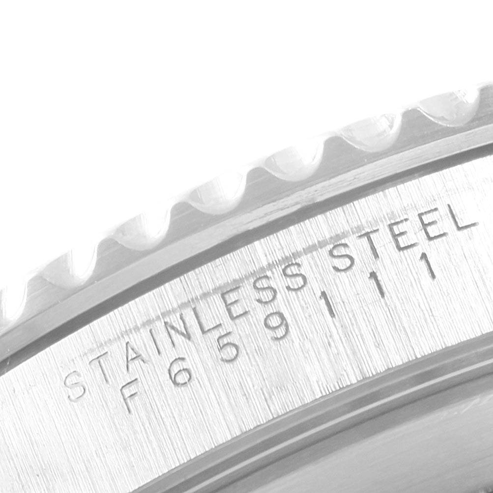 The image shows a close-up of the stainless steel bezel and engraved serial number on a Rolex Submariner 14060 Men's Stainless Steel Black Dial 14060 Men's Stainless Steel Black Dial watch.