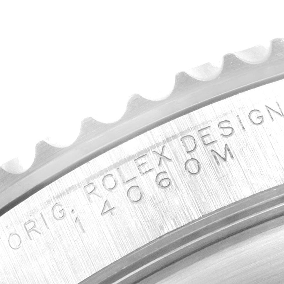 The image shows a close-up of the bezel and engraved side of a Rolex Submariner 14060 Men's Stainless Steel Black Dial 14060 Men's Stainless Steel Black Dial watch.