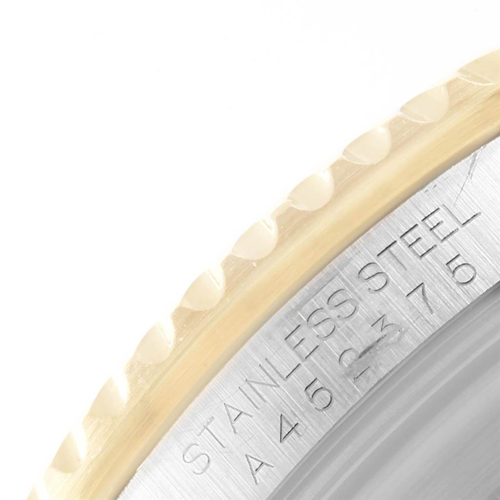 This image shows a close-up of the flange and the outer edge of the caseback of a Rolex Submariner 16613 Men's Steel and Gold (two tone) Blue Dial 16613 Men's Steel and Gold (two tone) Blue Dial watch.