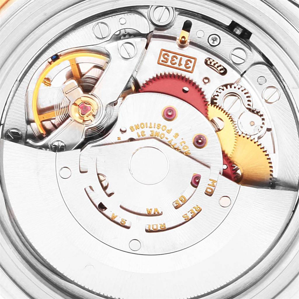 This close-up image shows the inner mechanical movement parts of a Rolex Submariner 16613 Men's Steel and Gold (two tone) Blue Dial 16613 Men's Steel and Gold (two tone) Blue Dial watch.