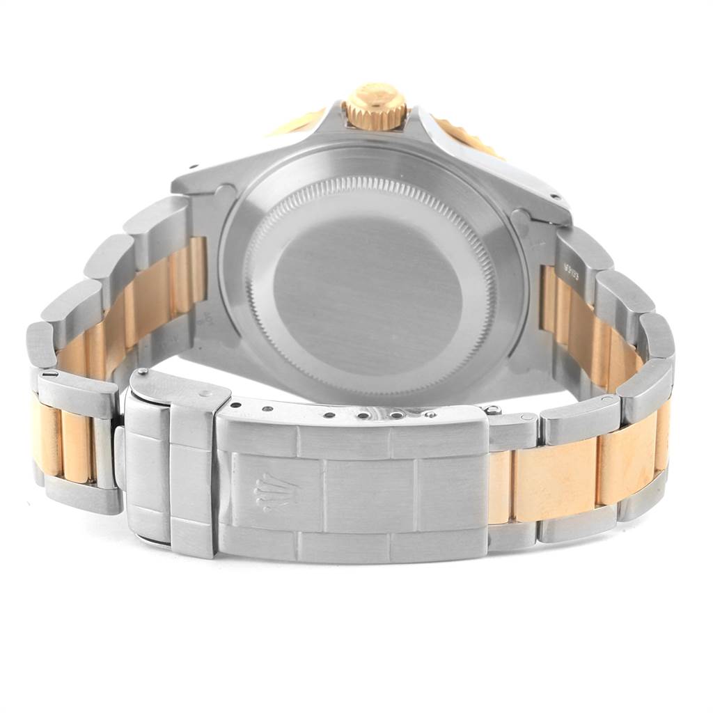 This image shows the back view of a Rolex Submariner 16613 Men's Steel and Gold (two tone) Blue Dial 16613 Men's Steel and Gold (two tone) Blue Dial watch, highlighting the case back and the bracelet.