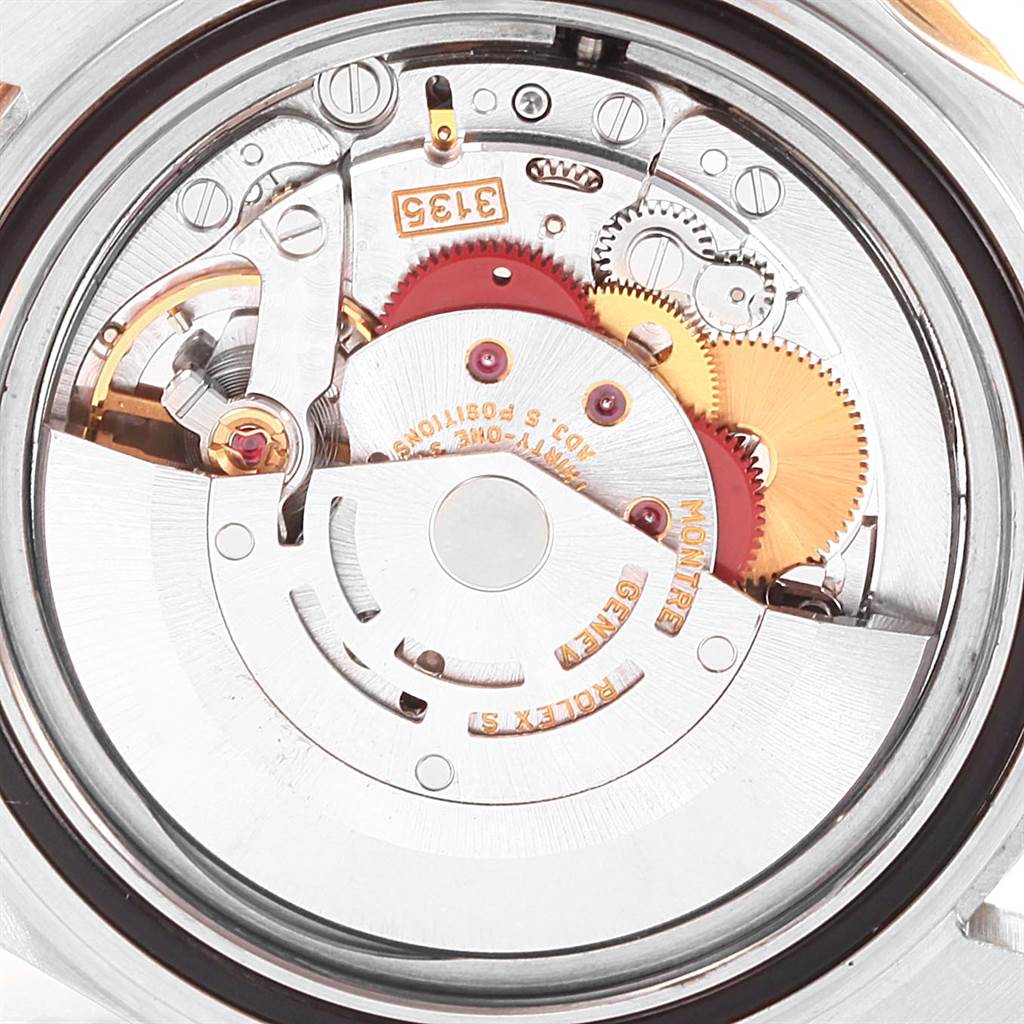 This image shows a close-up view of the movement mechanism inside a Rolex Submariner 16613 Men's Steel and Gold (two tone) Blue Dial 16613 Men's Steel and Gold (two tone) Blue Dial watch.