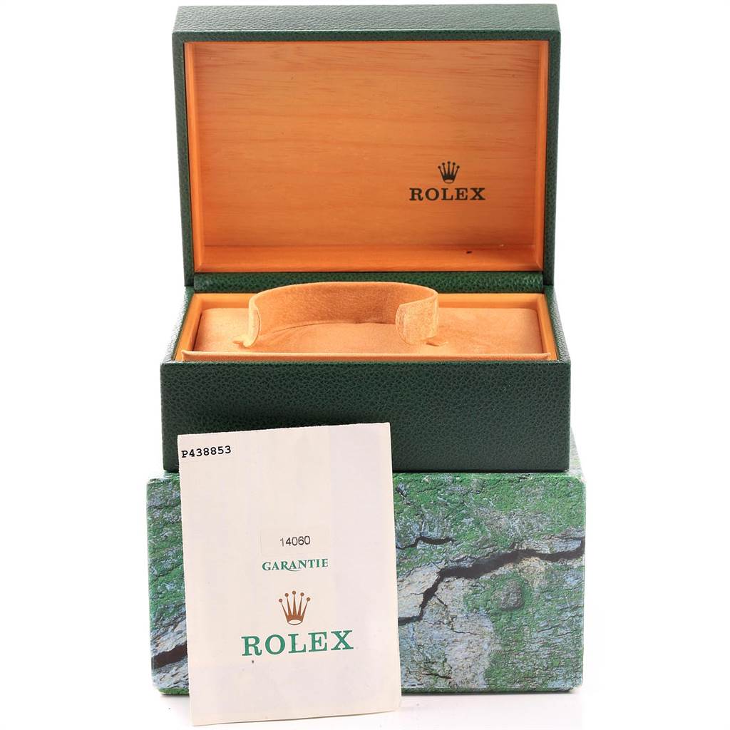 The image shows a Rolex Submariner 14060 Men's Stainless Steel Black Dial 14060 Men's Stainless Steel Black Dial box (green and tan), and a warranty card with the watch's model number 14060.