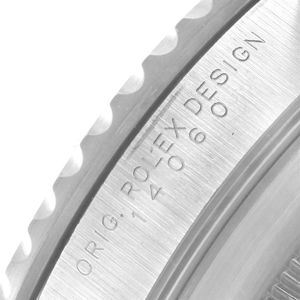 This close-up image shows the engraved bezel and part of the case of a Rolex Submariner 14060 Men's Stainless Steel Black Dial 14060 Men's Stainless Steel Black Dial watch.
