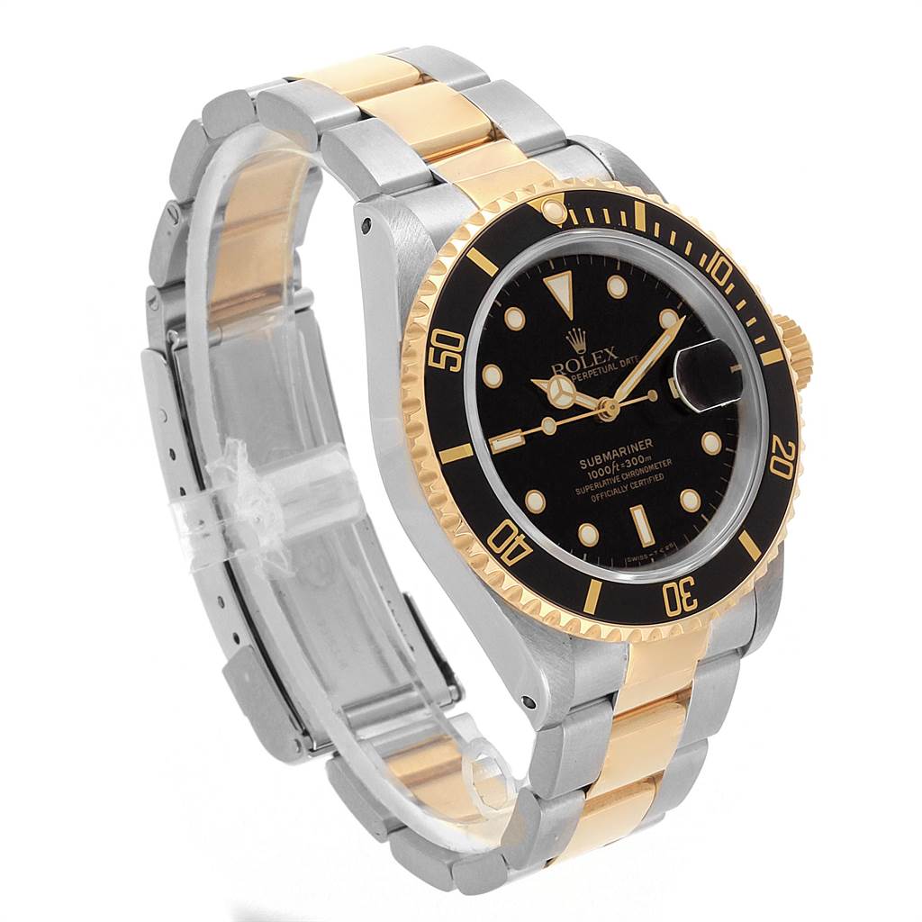 The image shows a Rolex Submariner 16613 Men's Steel and Gold (two tone) Black Dial 16613 Men's Steel and Gold (two tone) Black Dial watch at a 3/4 angle, highlighting the black dial, bezel, and two-tone oyster bracelet.