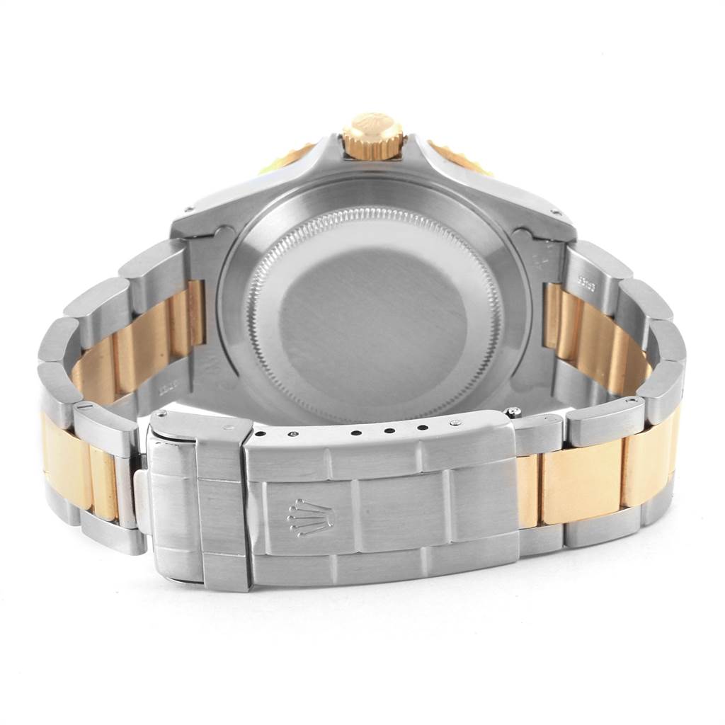 The image shows the back case and clasp of a Rolex Submariner 16613 Men's Steel and Gold (two tone) Black Dial 16613 Men's Steel and Gold (two tone) Black Dial watch from a rear angle.