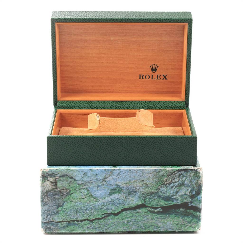 The image shows an open Rolex Submariner 16613 Men's Steel and Gold (two tone) Black Dial 16613 Men's Steel and Gold (two tone) Black Dial watch box with a green exterior and wooden interior.