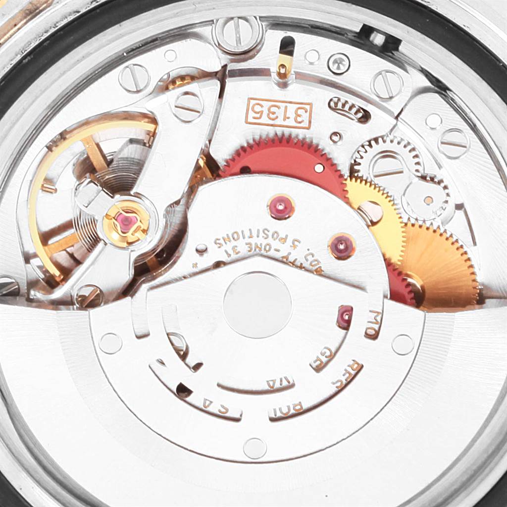 This image shows the internal movement mechanism of a Rolex Submariner 16613 Men's Steel and Gold (two tone) Black Dial 16613 Men's Steel and Gold (two tone) Black Dial watch from a close-up angle.