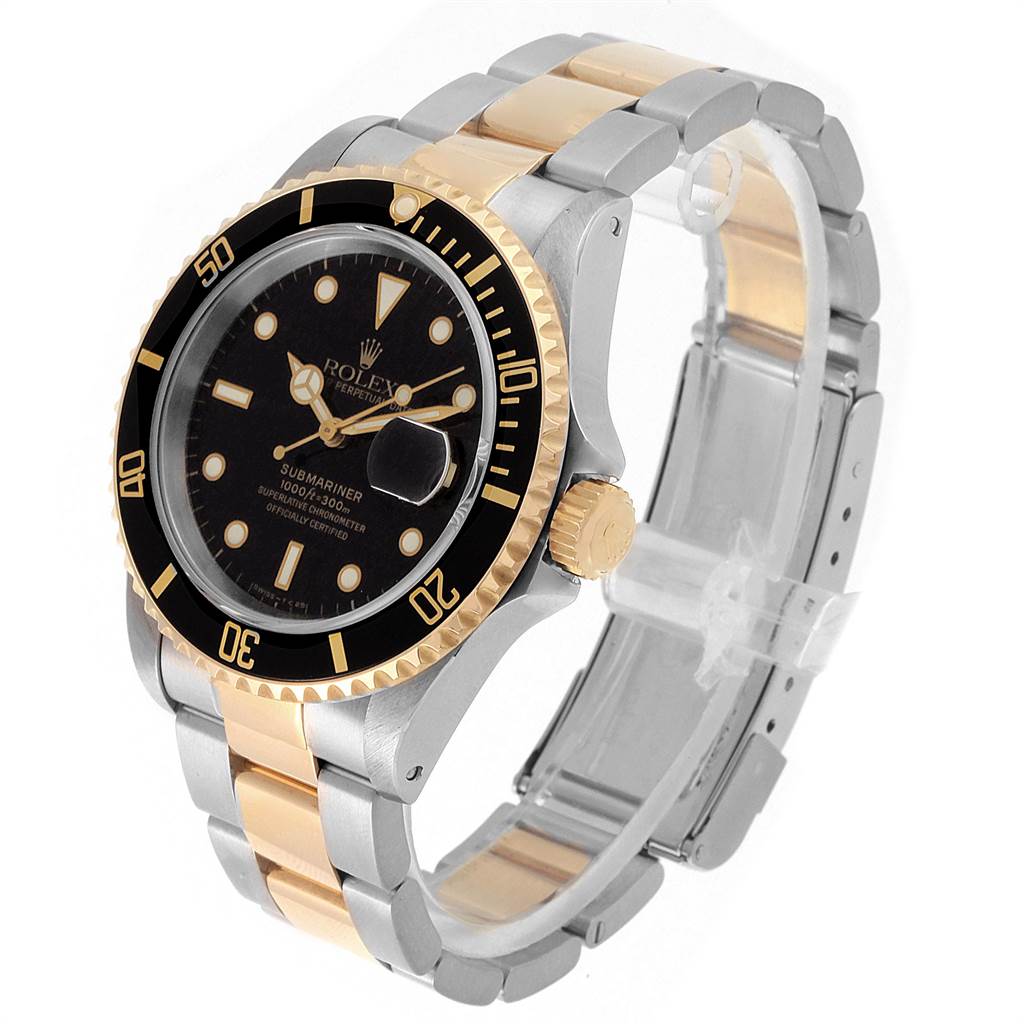 The Rolex Submariner 16613 Men's Steel and Gold (two tone) Black Dial 16613 Men's Steel and Gold (two tone) Black Dial is shown at a three-quarter angle, displaying the bezel, dial, crown, and two-tone bracelet.