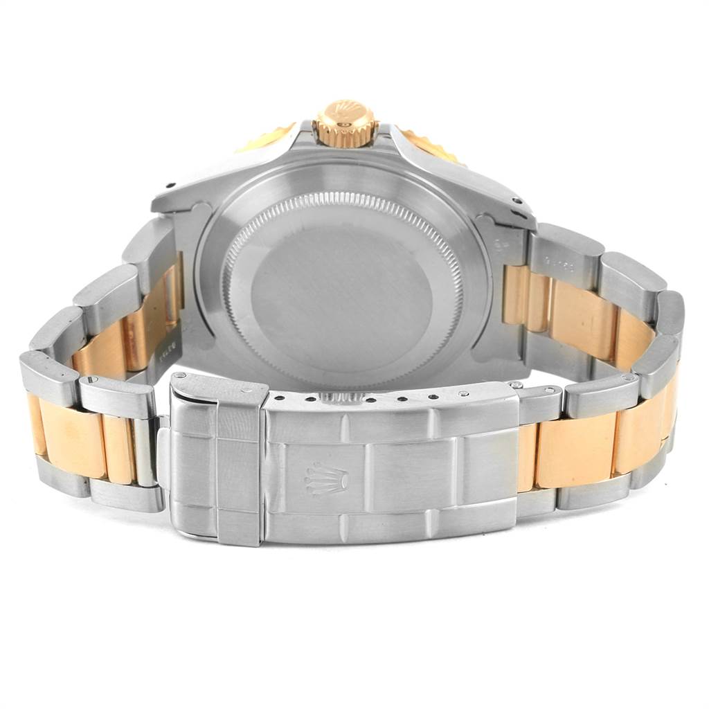 The angle showcases the back of the Rolex Submariner 16613 Men's Steel and Gold (two tone) Blue Dial 16613 Men's Steel and Gold (two tone) Blue Dial watch, highlighting the clasp and bracelet.