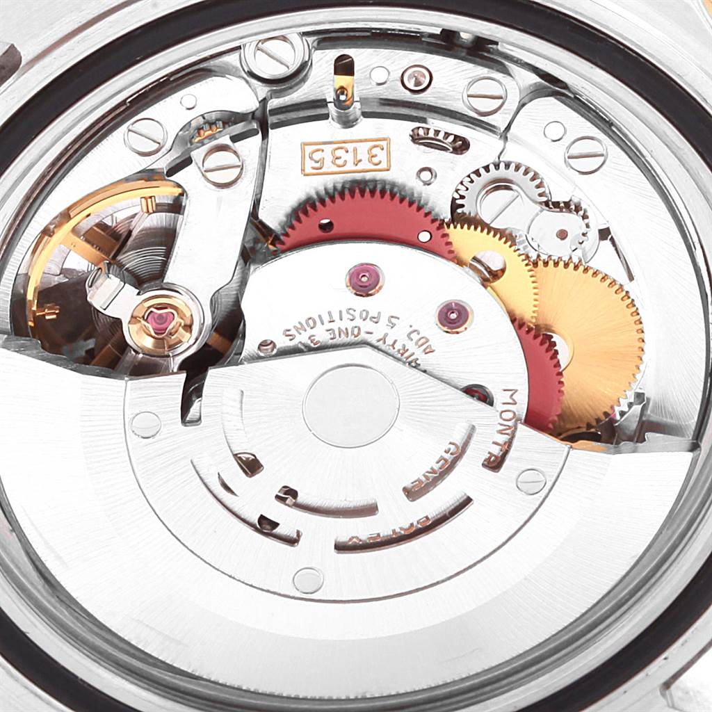 This image shows the internal movement mechanism of a Rolex Submariner 16613 Men's Steel and Gold (two tone) Blue Dial 16613 Men's Steel and Gold (two tone) Blue Dial watch from a close-up angle.