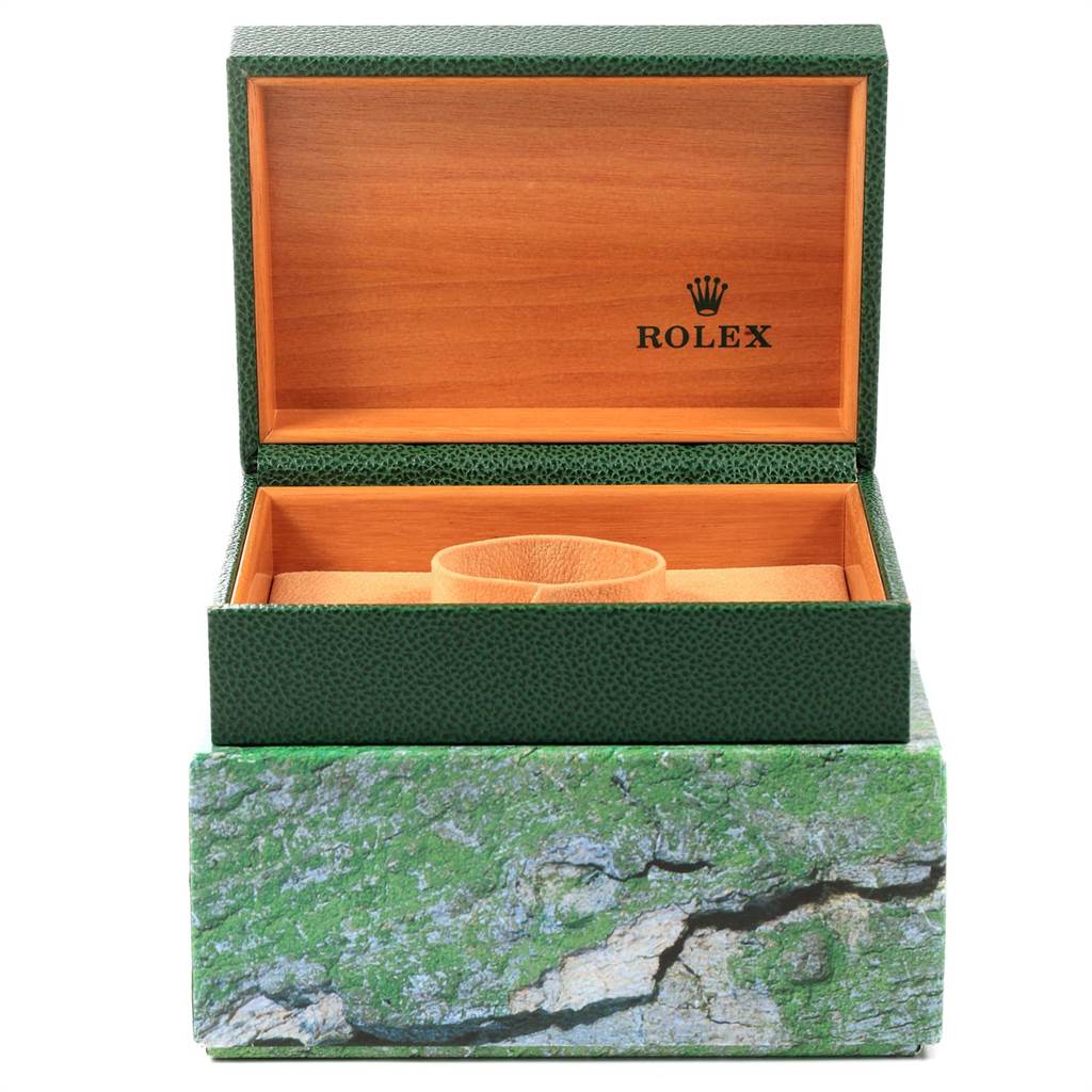 This image shows an open green Rolex Submariner 16613 Men's Steel and Gold (two tone) Blue Dial 16613 Men's Steel and Gold (two tone) Blue Dial watch box with a wooden interior, branded with the Rolex logo.
