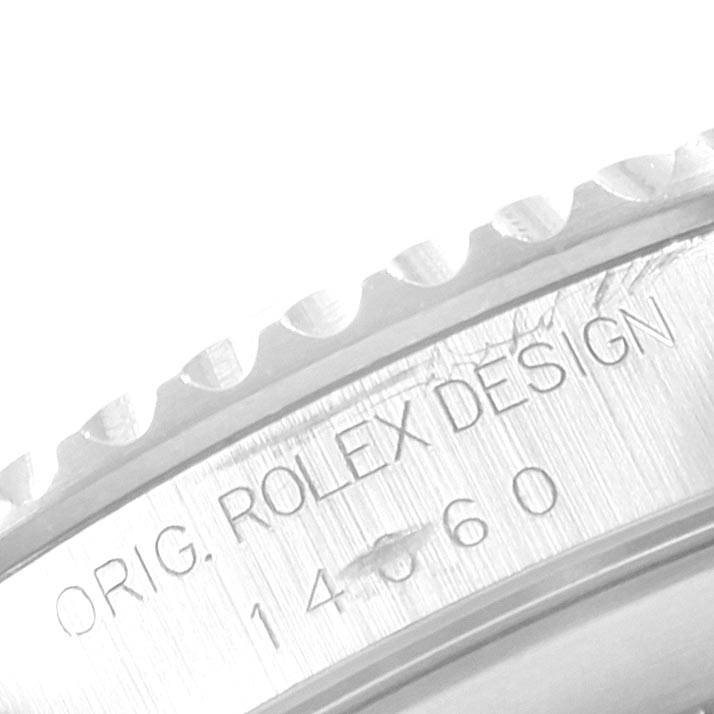 The image shows a close-up of the engraved bezel and inner case of a Rolex Submariner 14060 Men's Stainless Steel Black Dial 14060 Men's Stainless Steel Black Dial watch.
